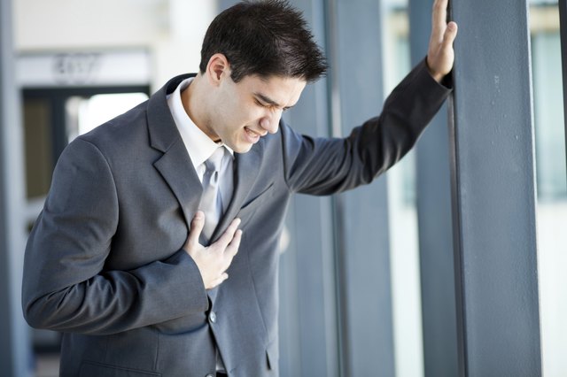 young businessman having heart attack