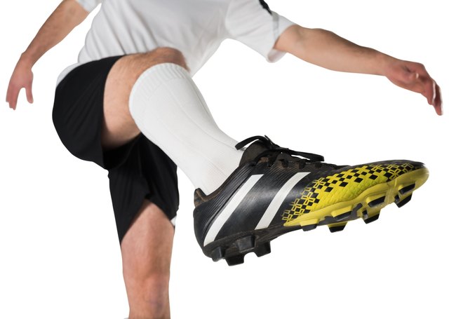 Football player in white kicking
