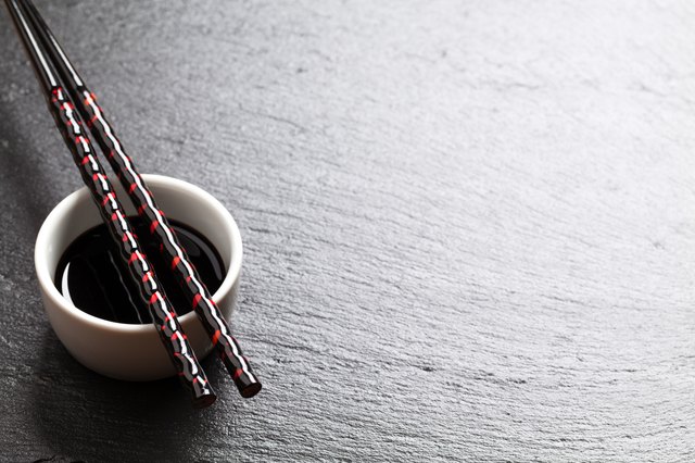 Japanese sushi chopsticks over soy sauce bowl