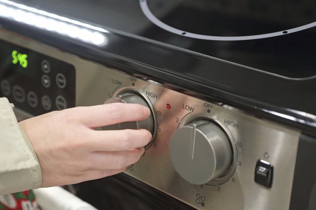 Woman using baking oven