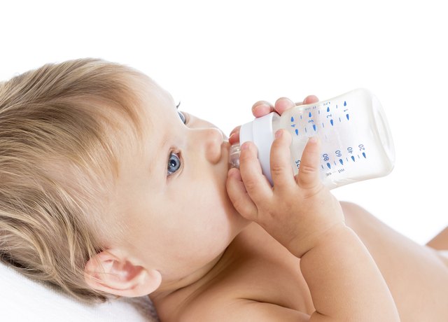 adorable child drinking from bottle