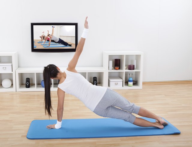 Woman practicing yoga at home