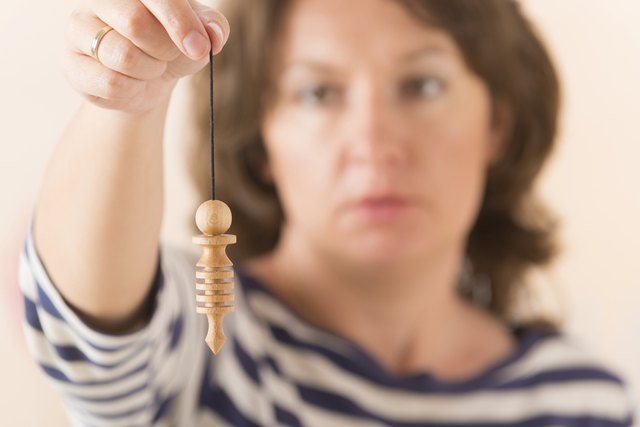 Woman using pendulum