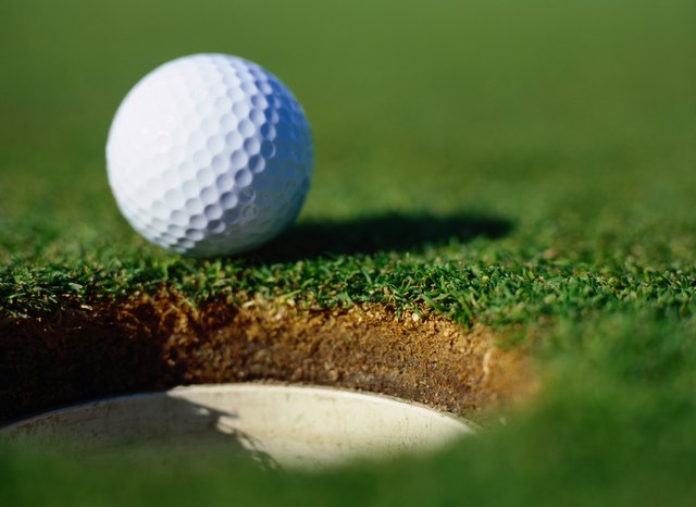 Golf Ball on the Edge of a Hole