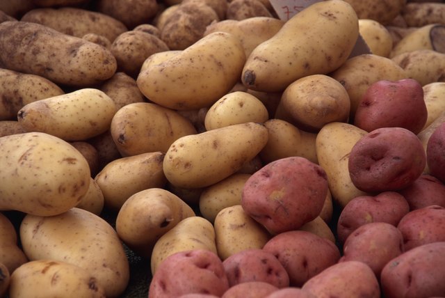 A stack of russet and red potatoes