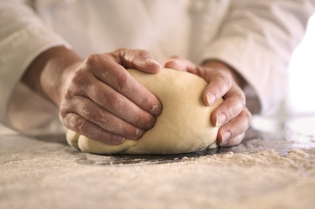 Hands kneading dough