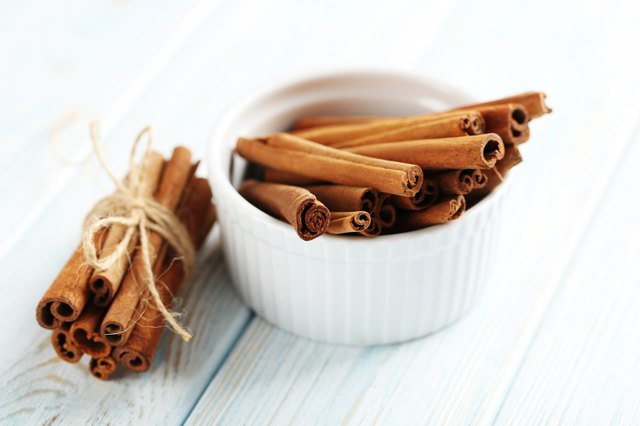 Cinnamon on a blue wooden background