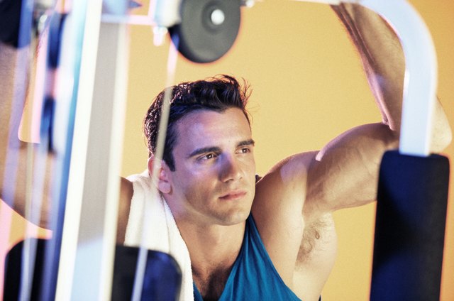 Fit man on exercise equipment