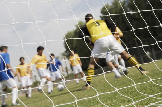 Soccer Players Competing for the Ball