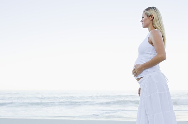 Pregnant woman on beach