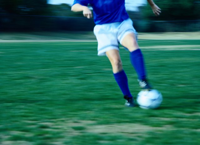 Soccer Player Running with Ball