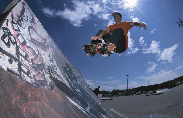 Skateboarding using ramp at skate park