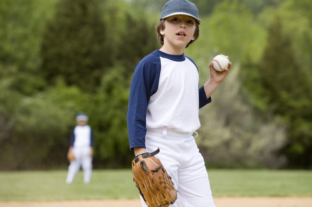 Little leaguer holding ball