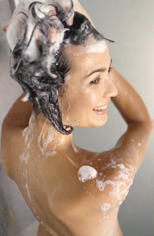 Woman cleaning in shower