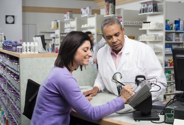 Customer paying pharmacist