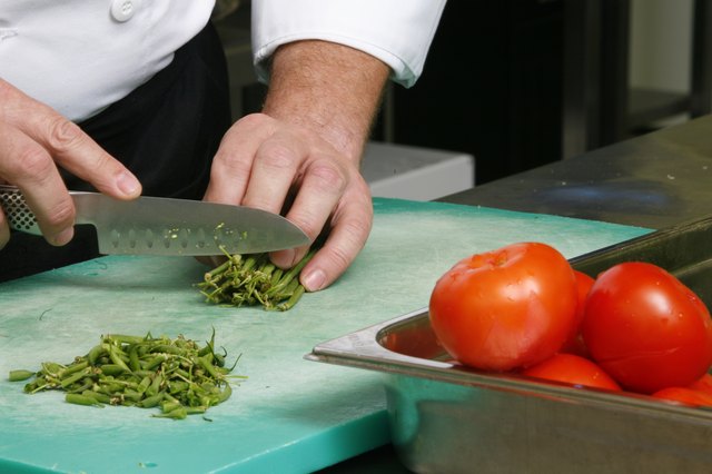 Close up of a person chopping vegetables