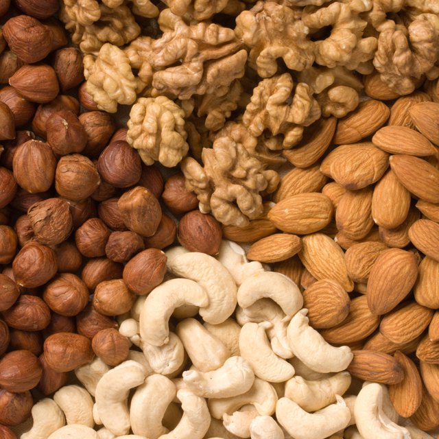 Different nuts (almonds, cashews, walnuts and filbers) close up