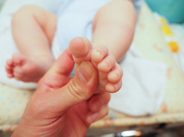 Baby receiving foot massage