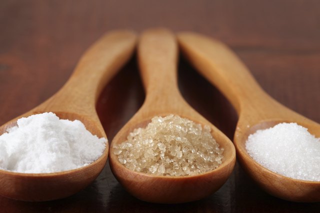 Sugar in wooden spoons