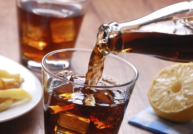 pouring cola in glass