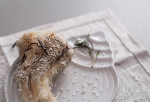 Cooked on steam grenadier fish with sea salt