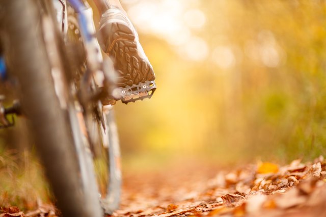 foot on pedal of bicycle