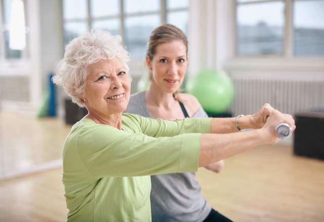 Fitness training with a personal trainer at gym