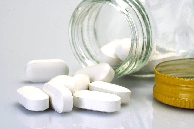 Pills spilling out of pill bottle