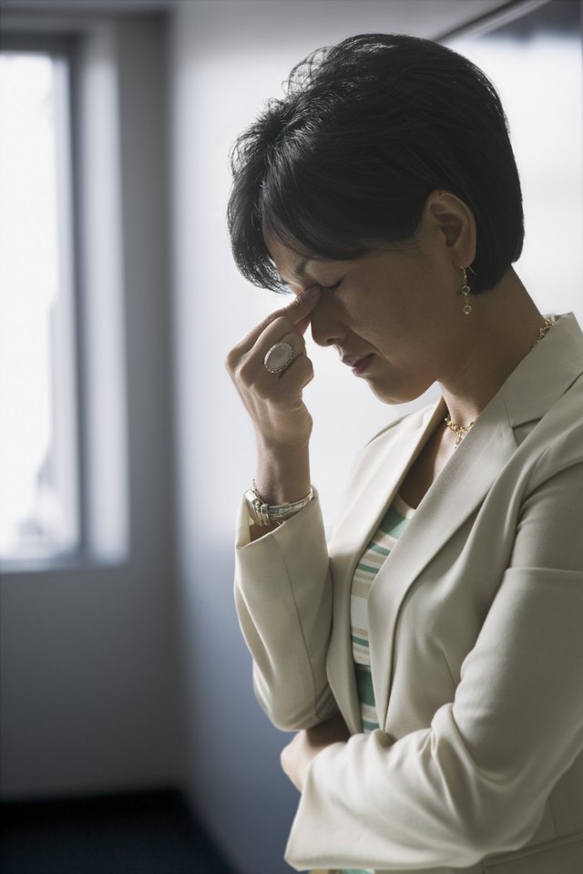Mid adult woman with a headache