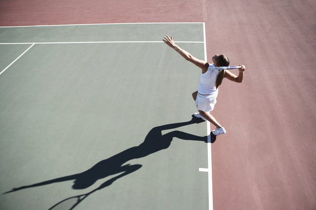 Young woman playing tennis, elevated view