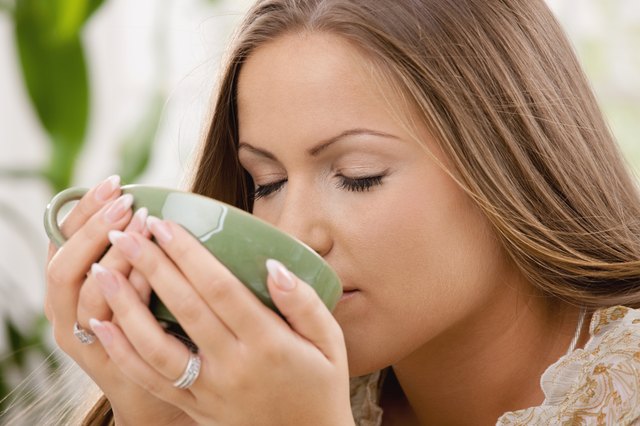 Beautiful girl drinking tea