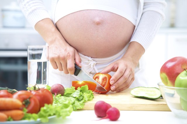 Pregnant woman cooking