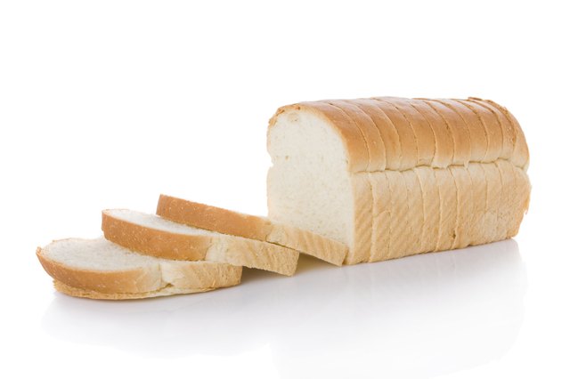 Sliced loaf of bread isolated on white