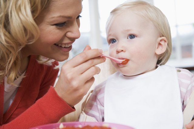 Mother feeding child
