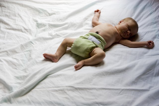 Newborn baby sleeping on the bed
