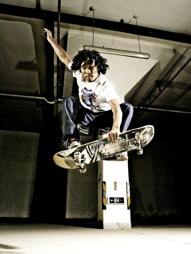 Man performing jump on skateboard