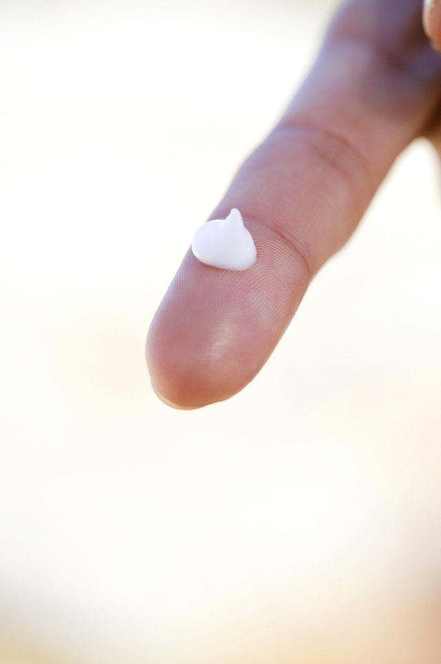 Drop of cream on a finger