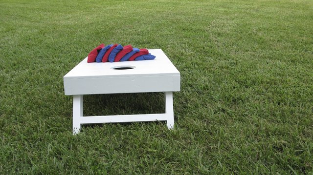 Wide angle shot of cornhole board and eight bags