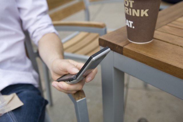 Person using mobile phone, close up