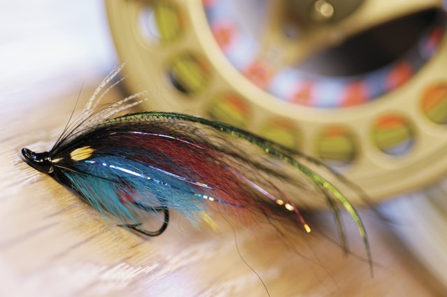 Close-up of a fishing lure and a fishing reel