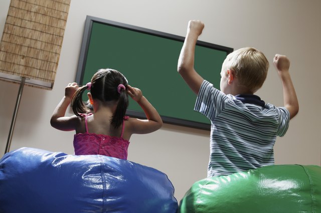 Children celebrating on bean bags