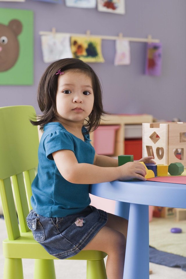 Toddler playing with blocks at daycare
