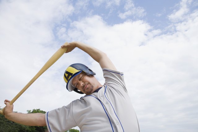 Serious baseball player stretching