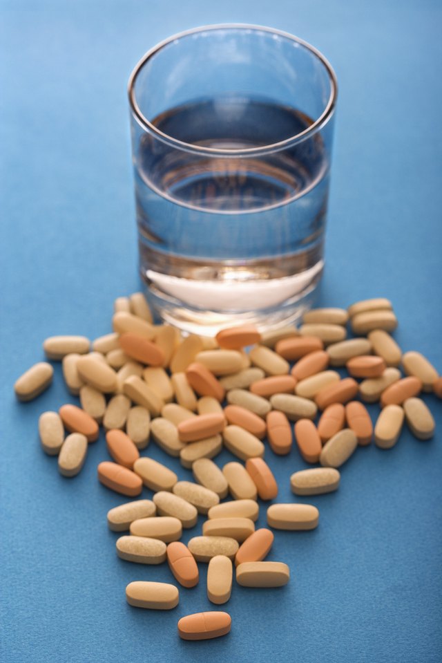 Glass of water and pills