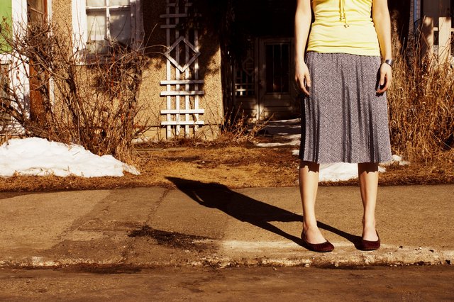 Woman waiting on the curb