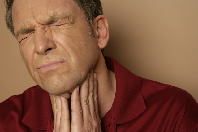 Mature man with sore throat