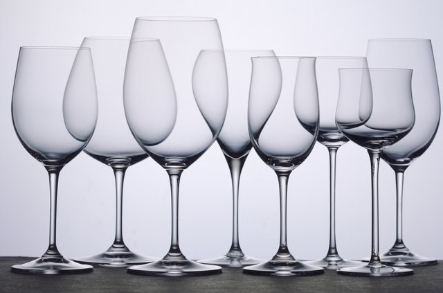 Transparent wine glasses in row, close-up