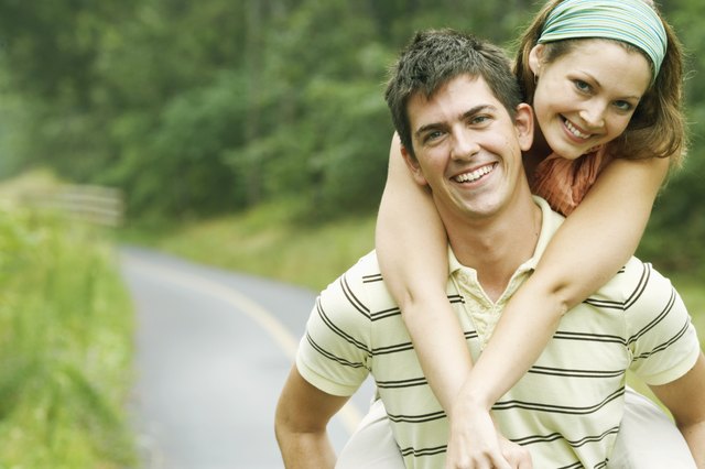 Man carrying woman on his back