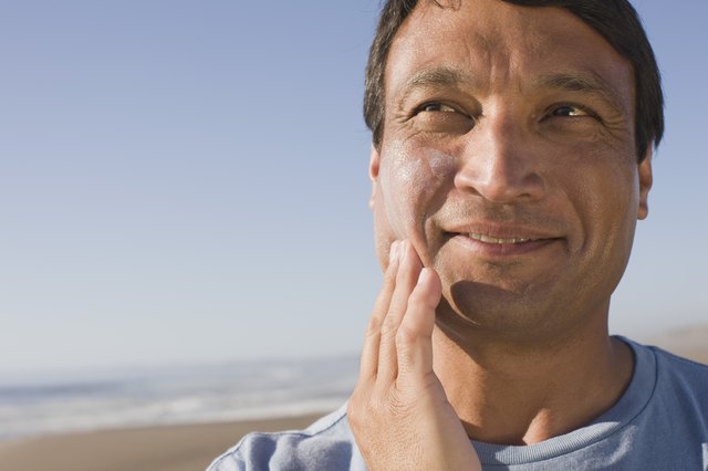 Man applying sunscreen