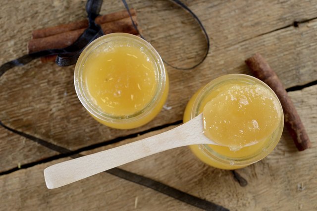 honey in jars on a wooden table
